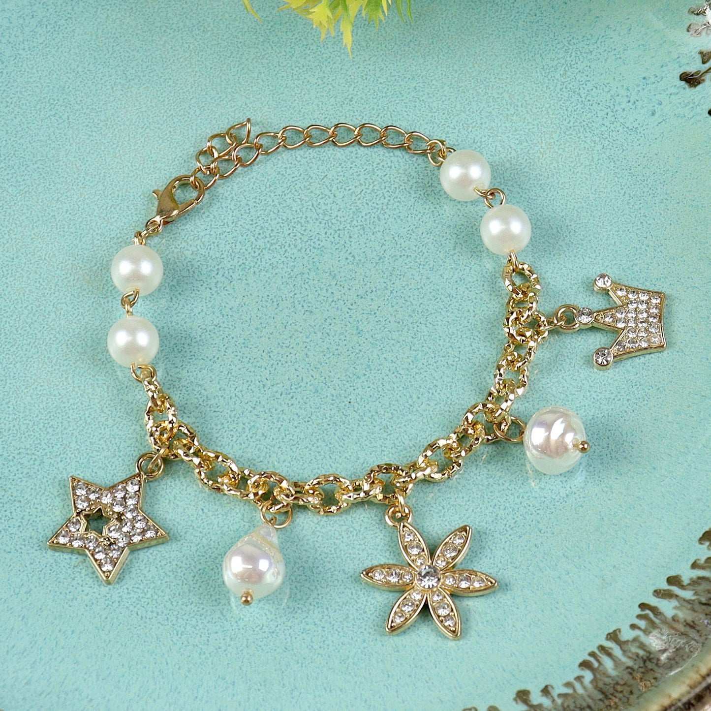 Multi Diamond Charms bracelet for girls in metal charms, laid flat