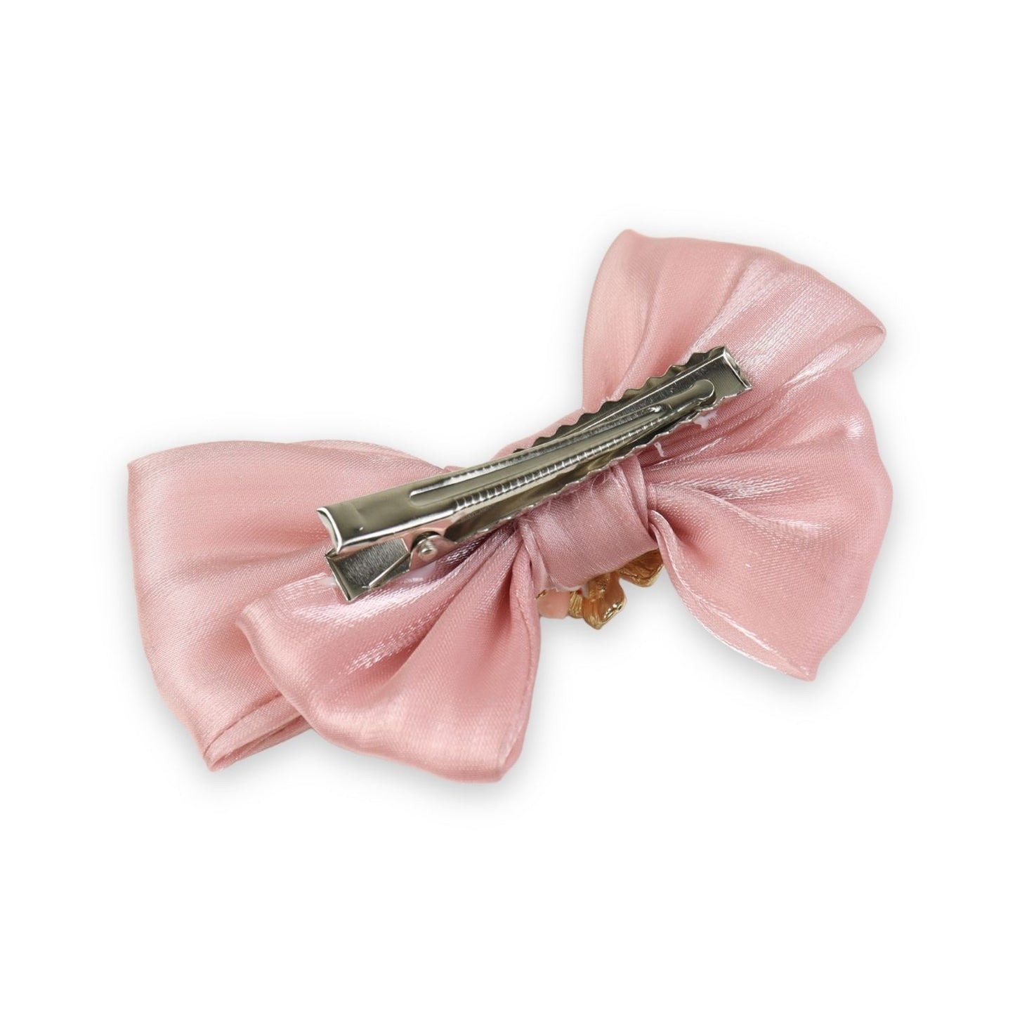 Close-up of the floral charm on the bow on the pink clip