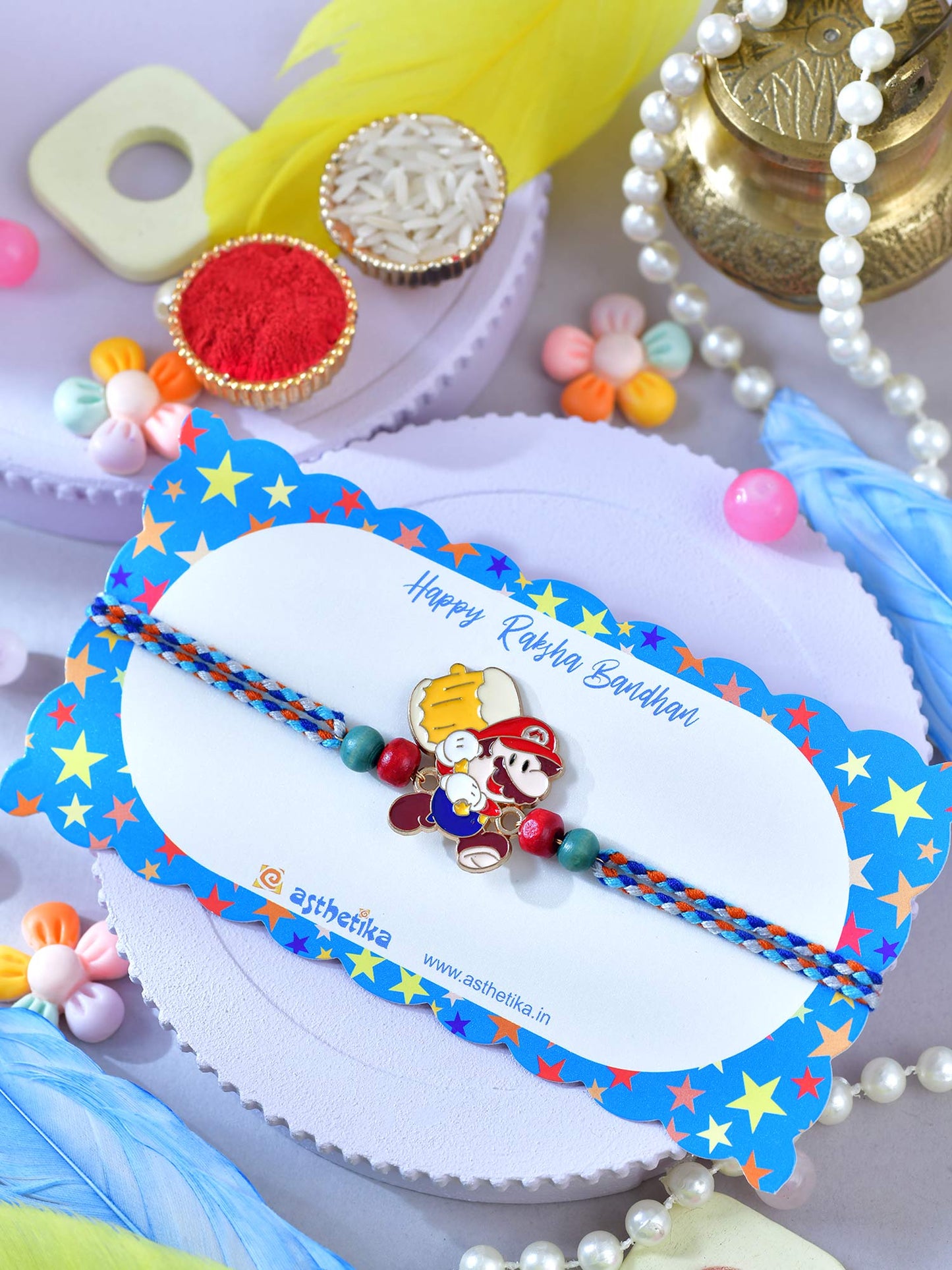 Asthetika cartoon plumber bracelet Rakhi in packaging