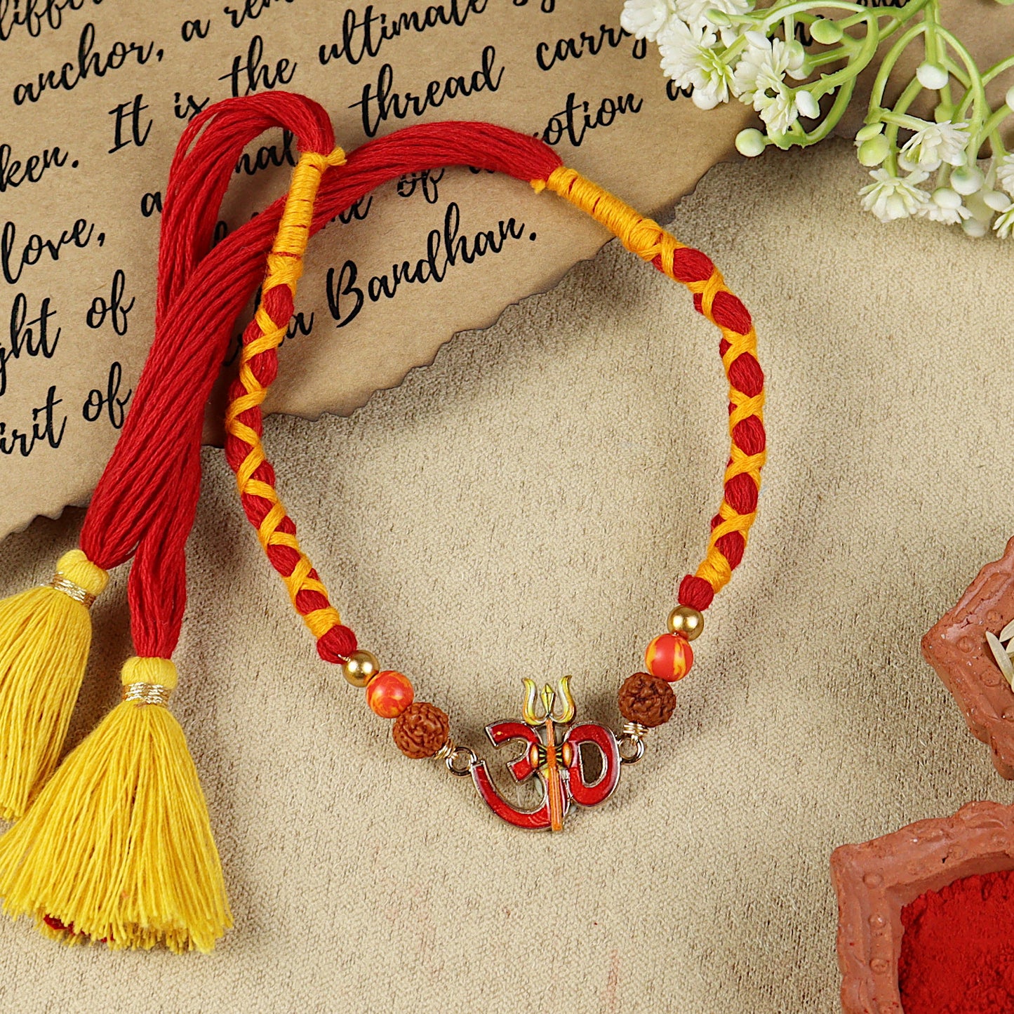 Om Rudraksh Thread Rakhi, laid flat