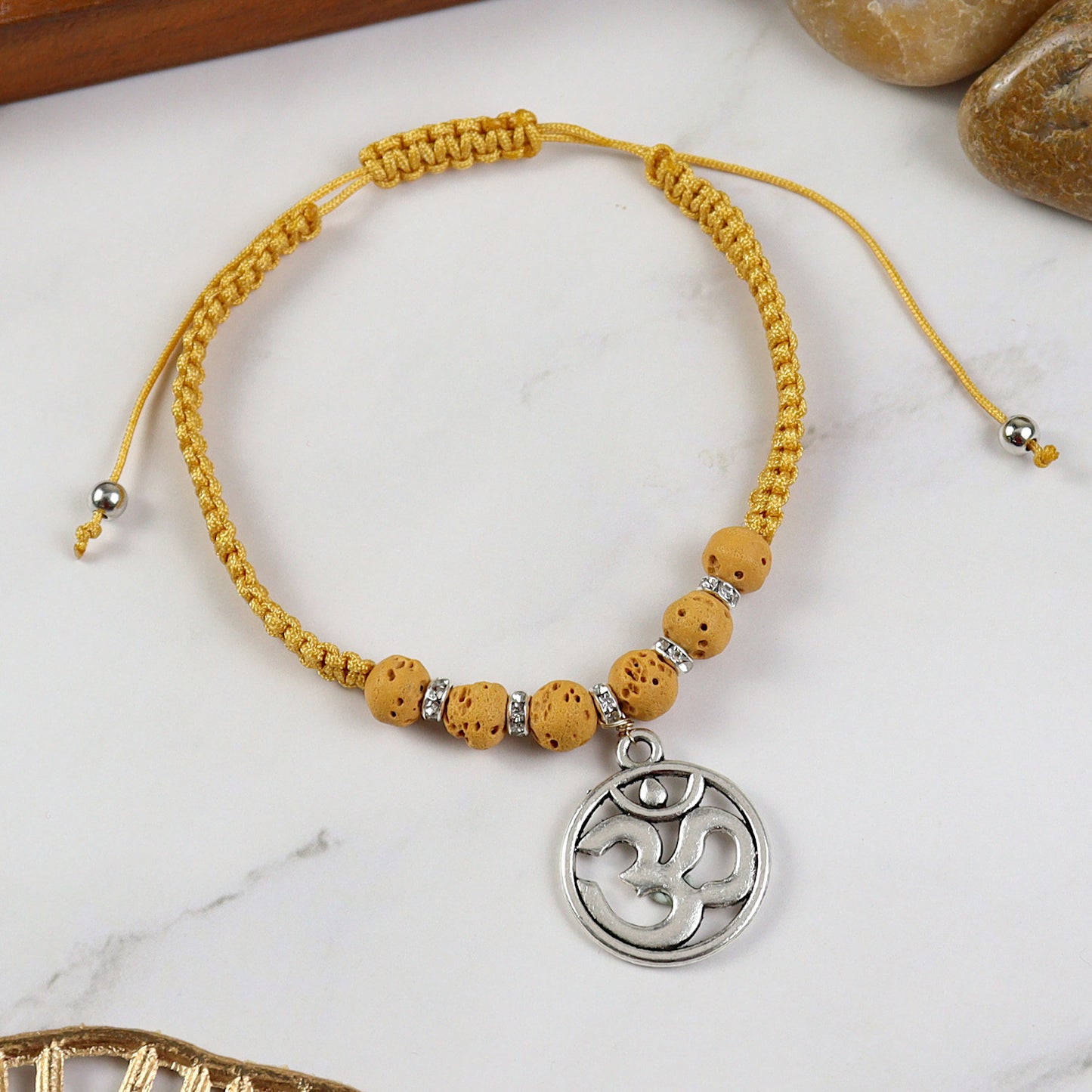 Beaded Om smart bracelet, laid flat