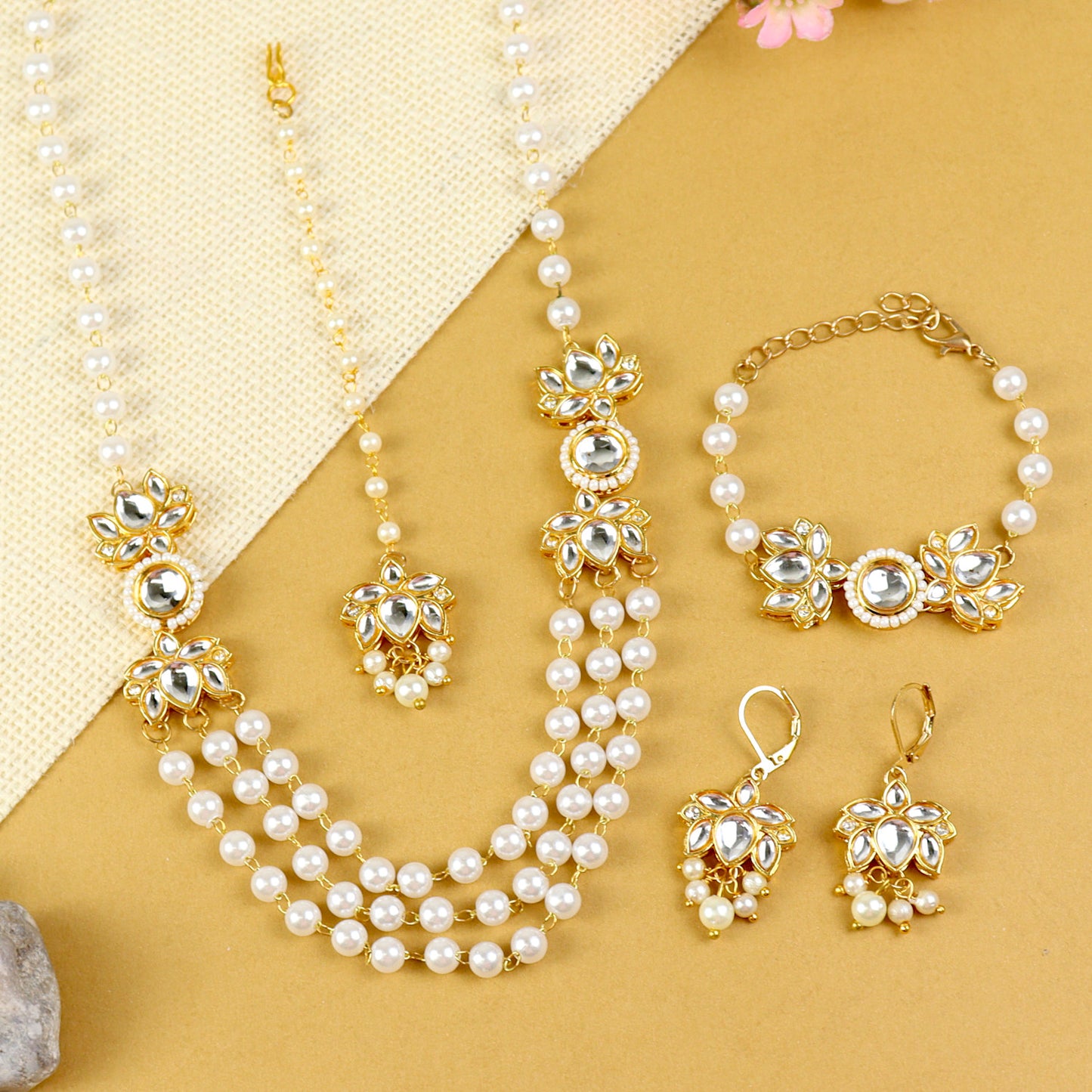 Kundan Lotus jewellery set for girls in gold-toned base, laid flat