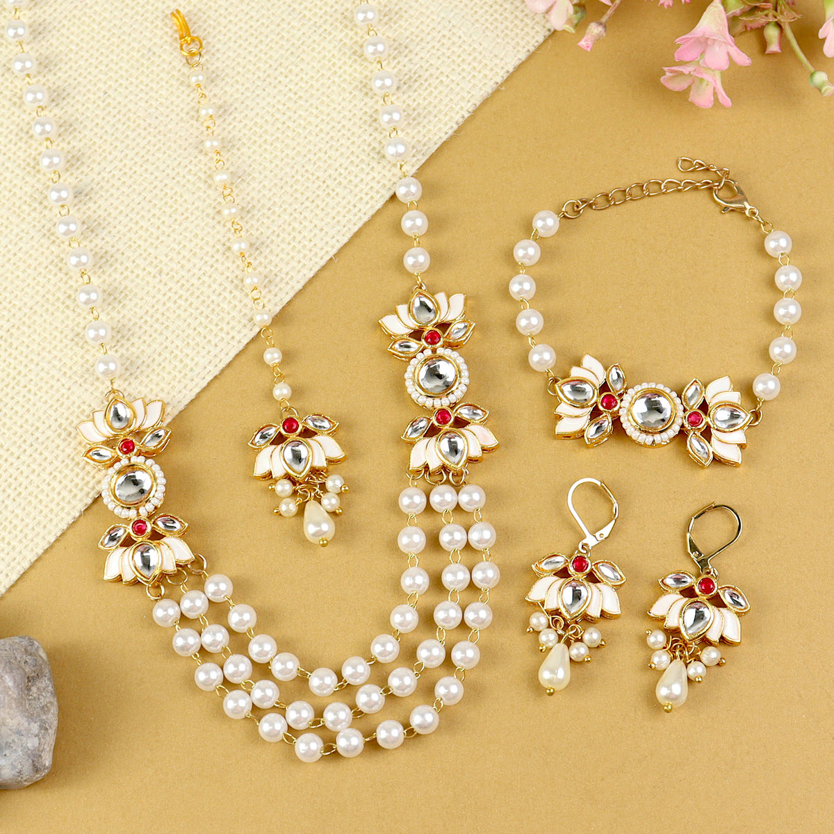 Kundan Lotus jewellery set for girls in gold-toned base, laid flat