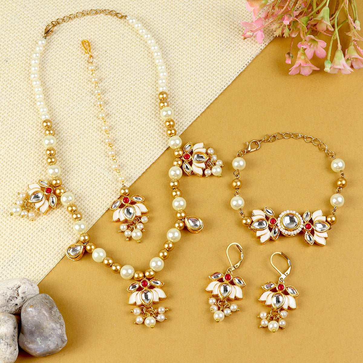 Kundan Lotus jewellery set for girls in gold-toned base, laid flat