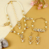 Kundan jewellery set for girls in gold-toned base, laid flat