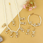 Kundan jewellery set for girls in gold-toned base, laid flat