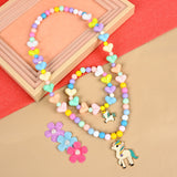 Unicorn charm stretch necklace and bracelet set, laid flat