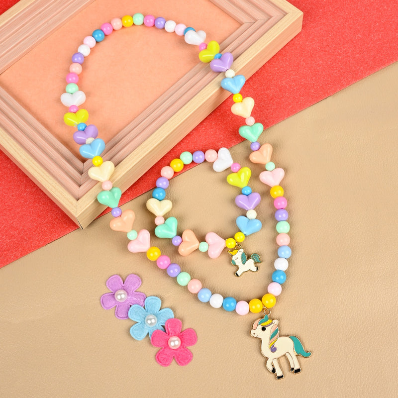 Unicorn charm stretch necklace and bracelet set, laid flat