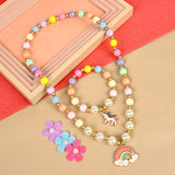 Unicorn rainbow charm necklace and bracelet set, laid flat