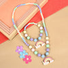 Rainbow charm necklace and bracelet set, laid flat