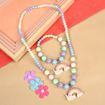 Rainbow charm necklace and bracelet set, laid flat