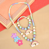 Rainbow charm necklace and bracelet set, laid flat