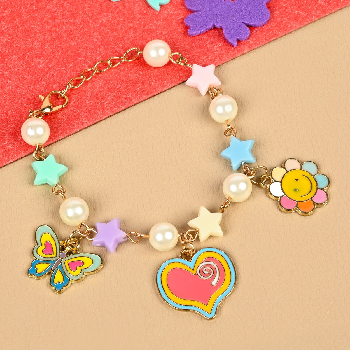 Butterfly heart charm chain bracelet, laid flat