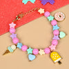 Ice-cream donut beaded charm bracelet, laid flat