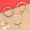 Set of 3 heart star Fimo bead bracelets, laid flat