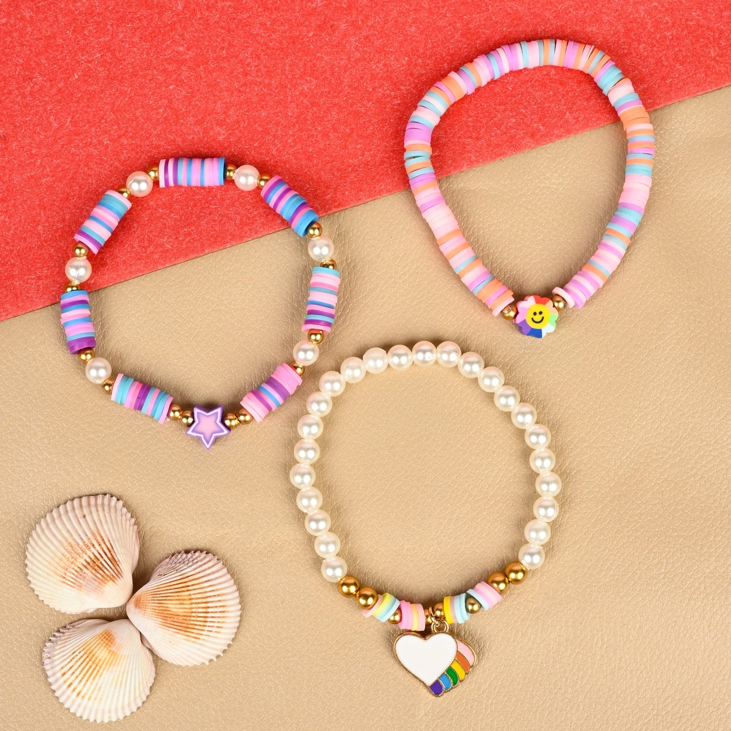 Set of 3 heart star Fimo bead bracelets, laid flat