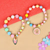 Set of 2 an ice-cream or donut charm beaded bracelets, laid flat