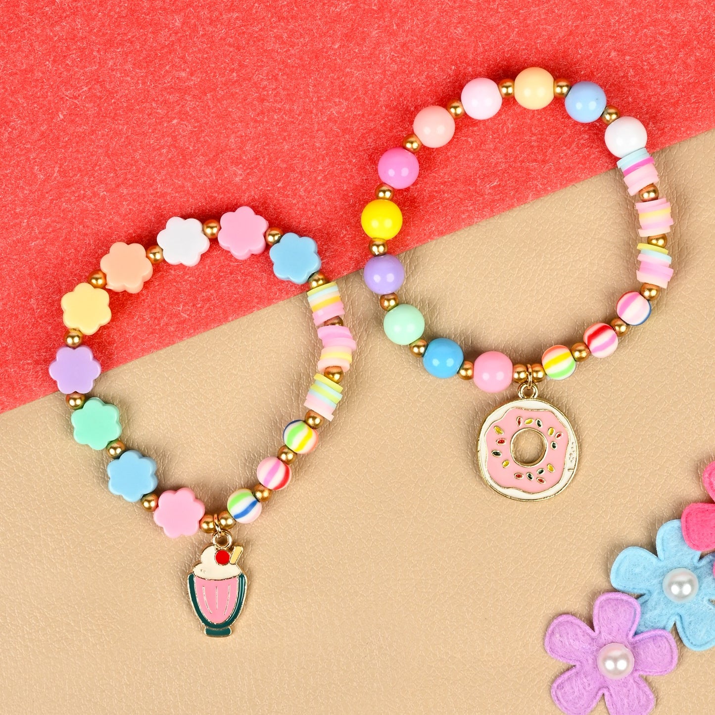 Set of 2 an ice-cream or donut charm beaded bracelets, laid flat