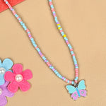 Butterfly charm necklace, laid flat