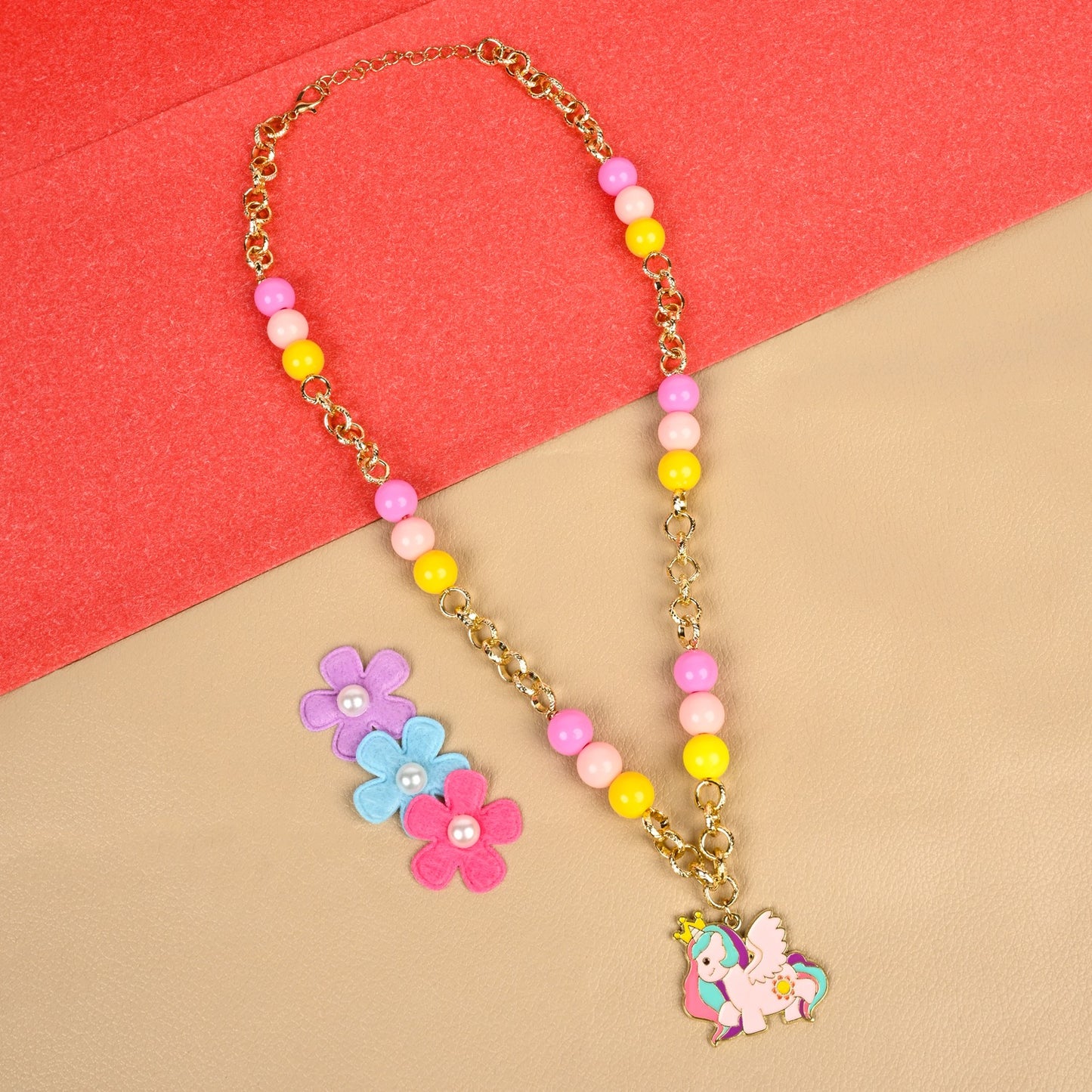 Unicorn charm necklace, laid flat
