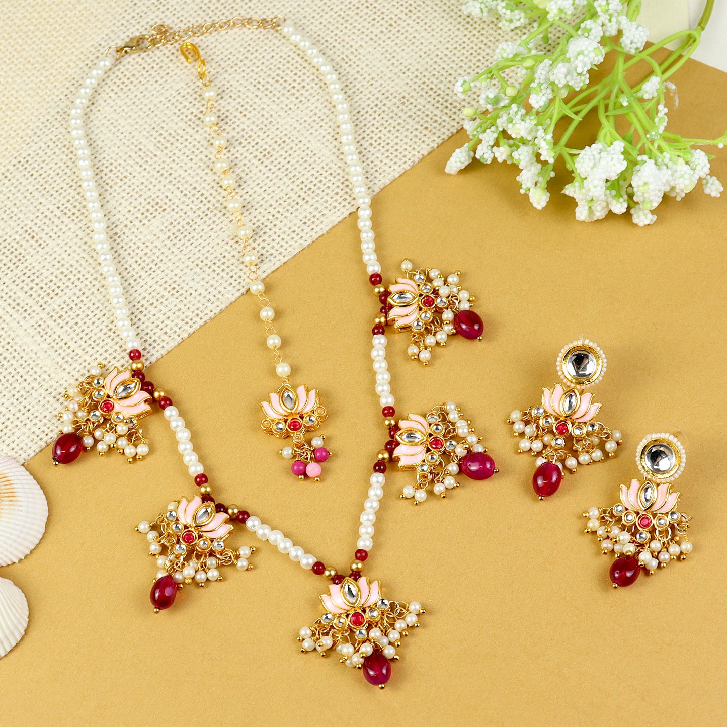 Kundan Lotus jewellery set for girls in gold-toned base, laid flat