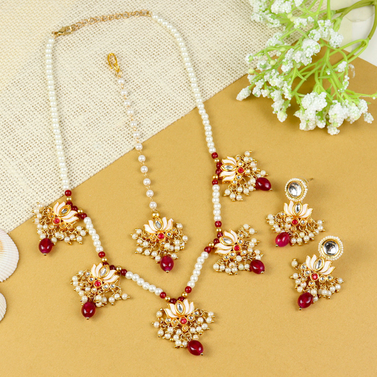 Kundan Lotus jewellery set for girls in gold-toned base, laid flat