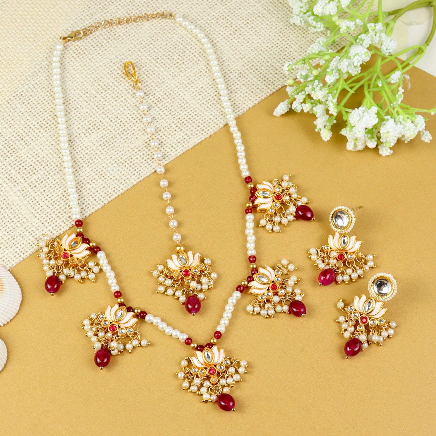 Kundan Lotus jewellery set for girls in gold-toned base, laid flat