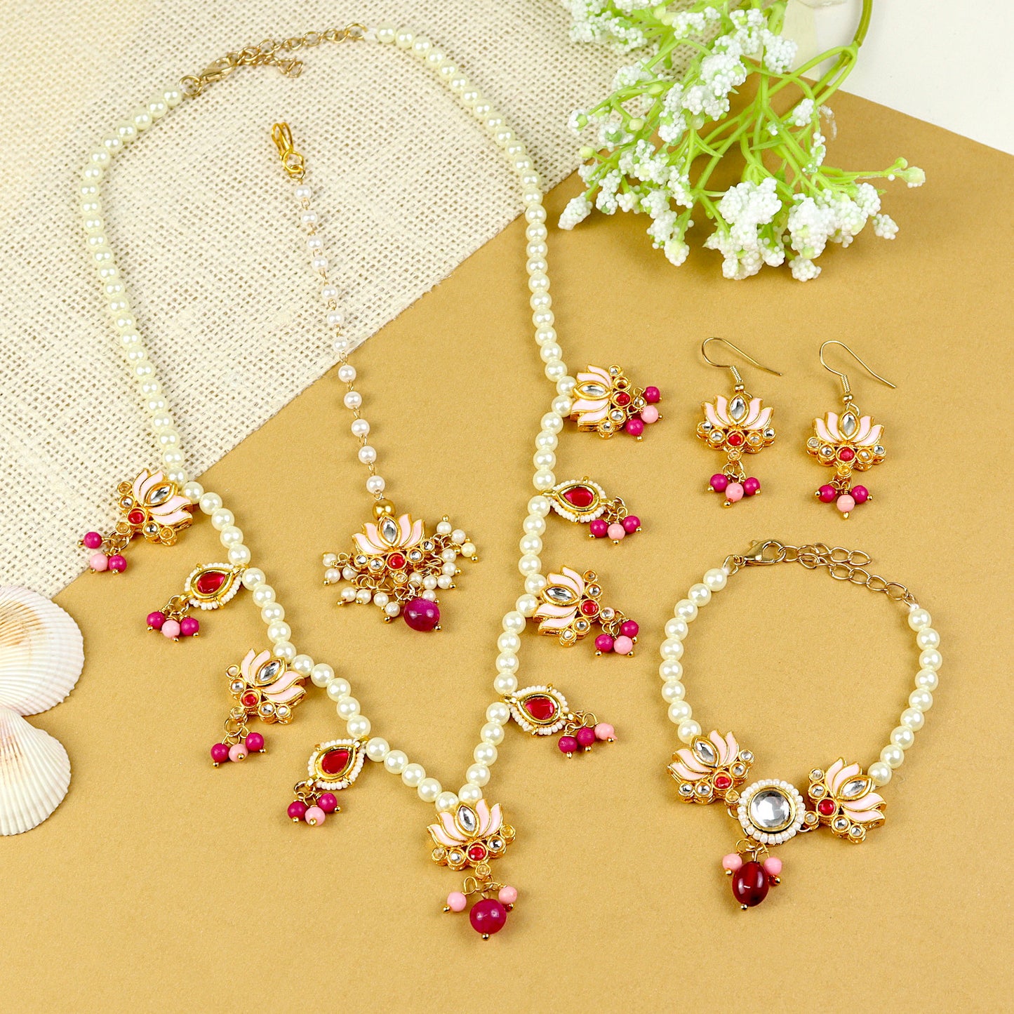 Kundan Lotus jewellery set for girls — necklace, earrings, maang tikka, and bracelet, laid flat