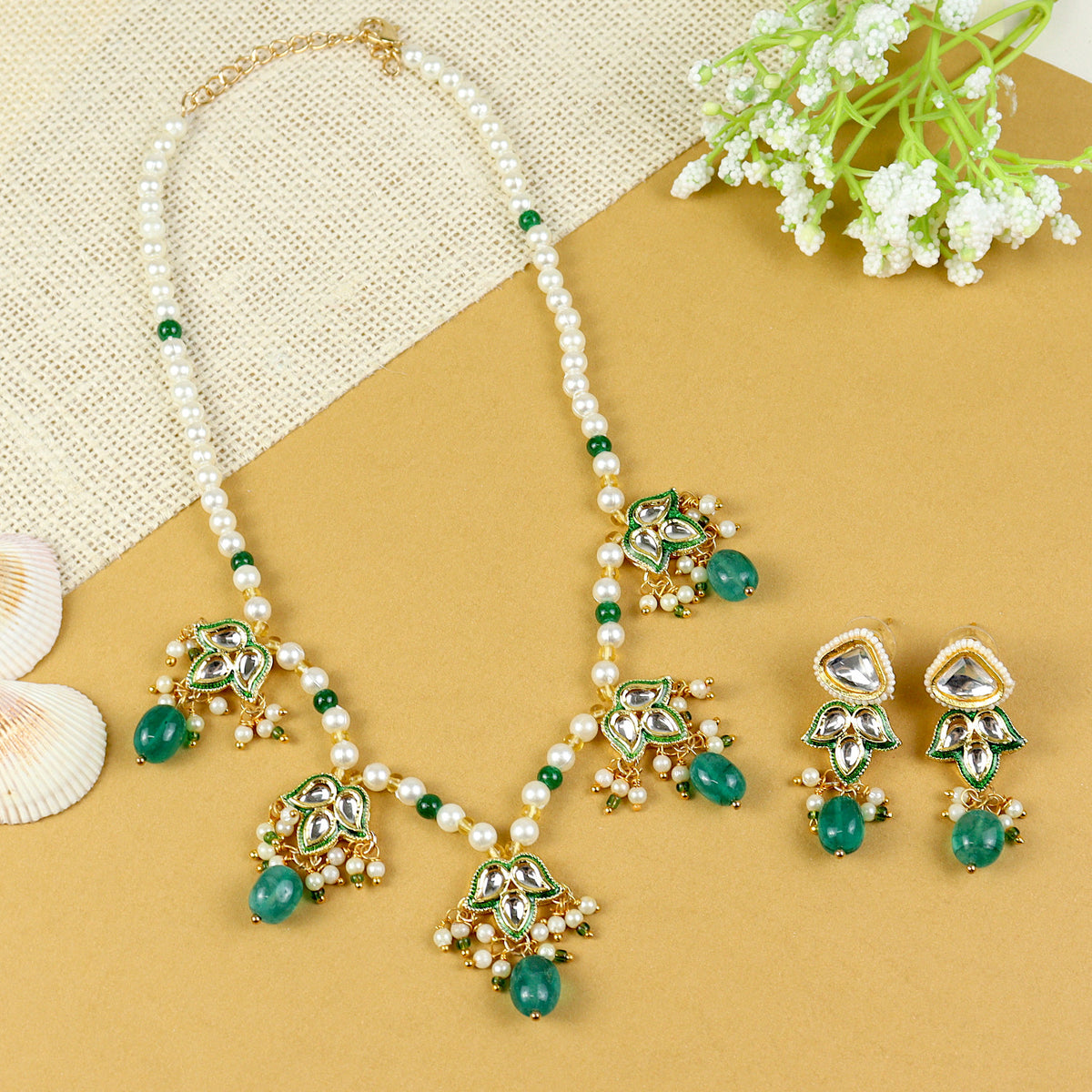 Kundan Lotus jewellery set for girls in gold-toned base, laid flat