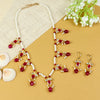 Kundan jewellery set for girls in gold-toned base, laid flat