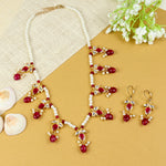 Kundan jewellery set for girls in gold-toned base, laid flat