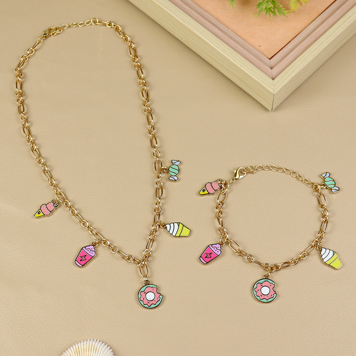 Multi Charm necklace and bracelet set for girls, laid flat