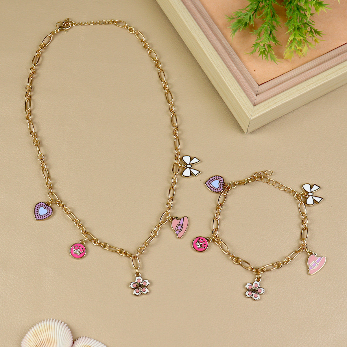 Multi Charm necklace and bracelet set for girls, laid flat
