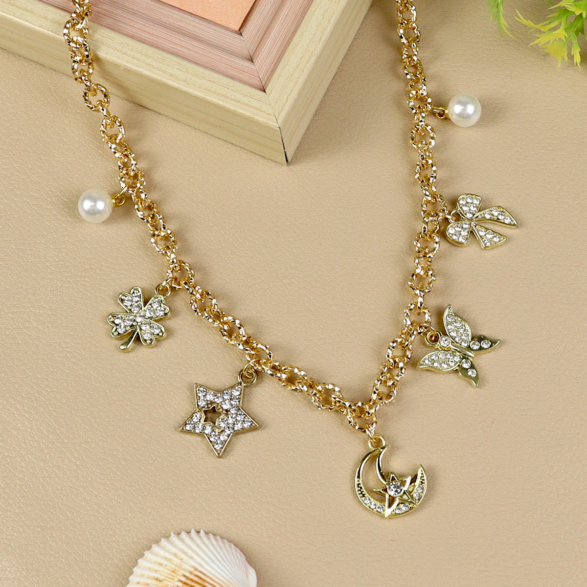 Multi Charm necklace for girls in metal charms, laid flat