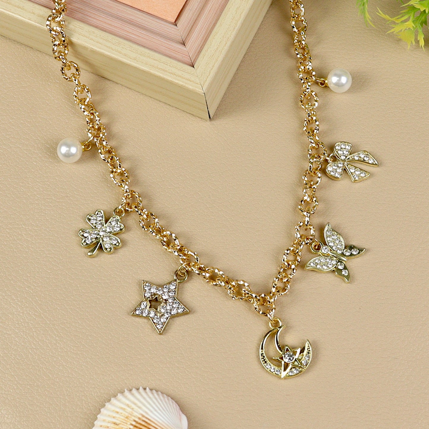 Multi Charm necklace for girls in metal charms, laid flat