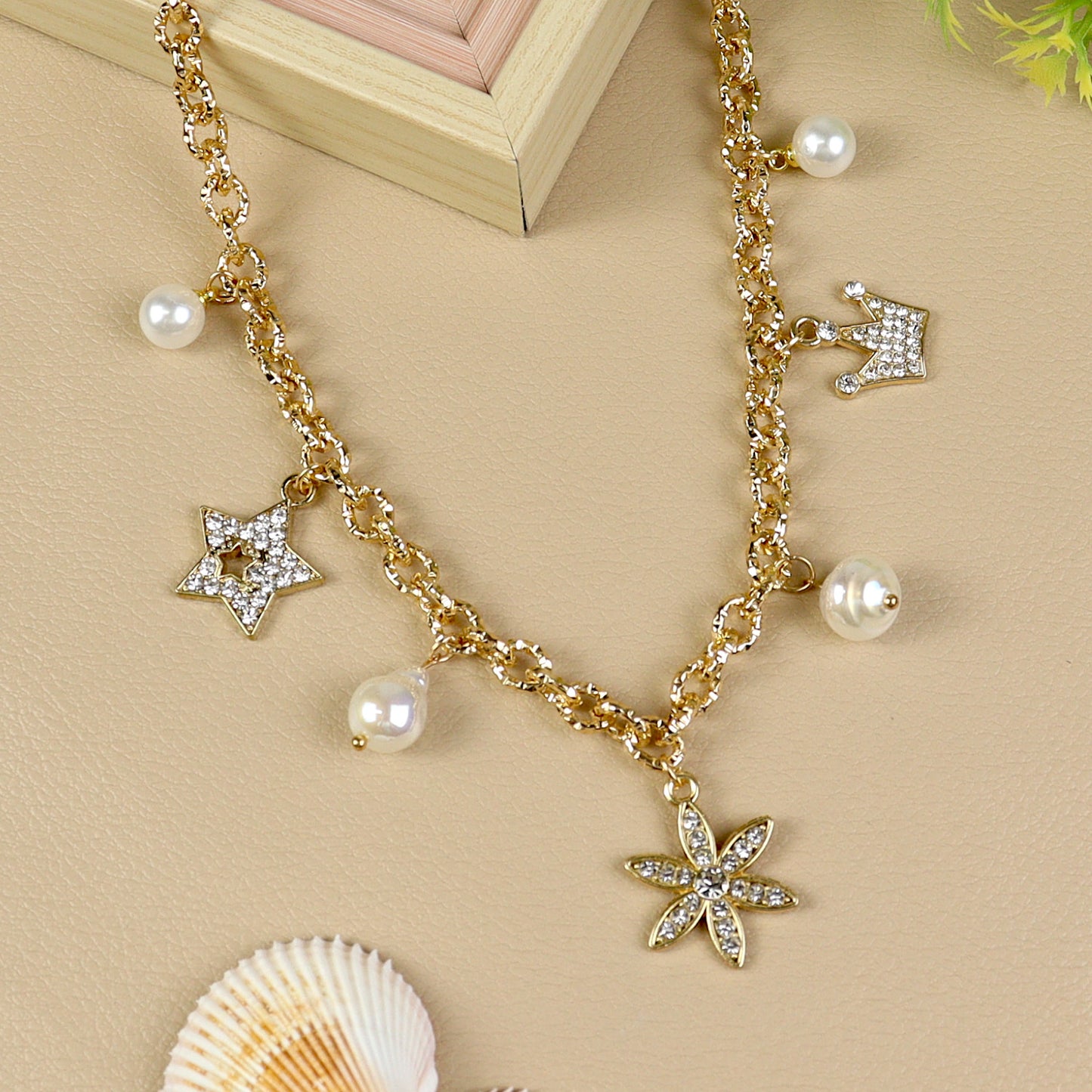 Multi Charm necklace for girls in metal charms, laid flat