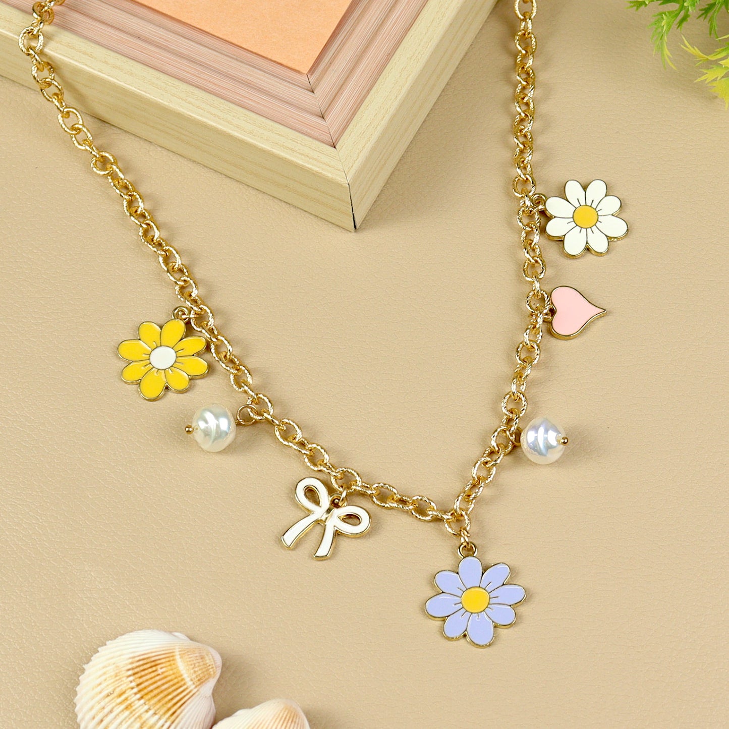 Floral Charm necklace for girls in metal charms, laid flat