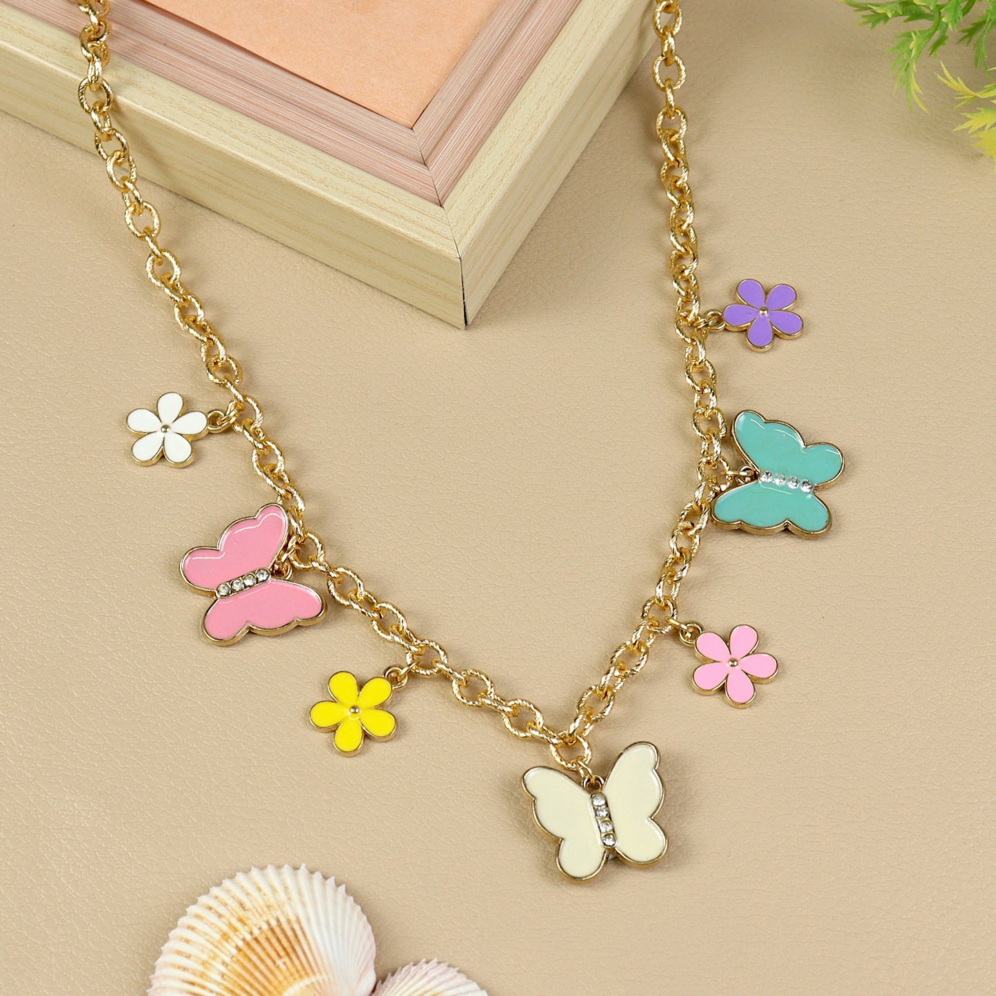 Butterfly Charm necklace for girls in metal charms, laid flat