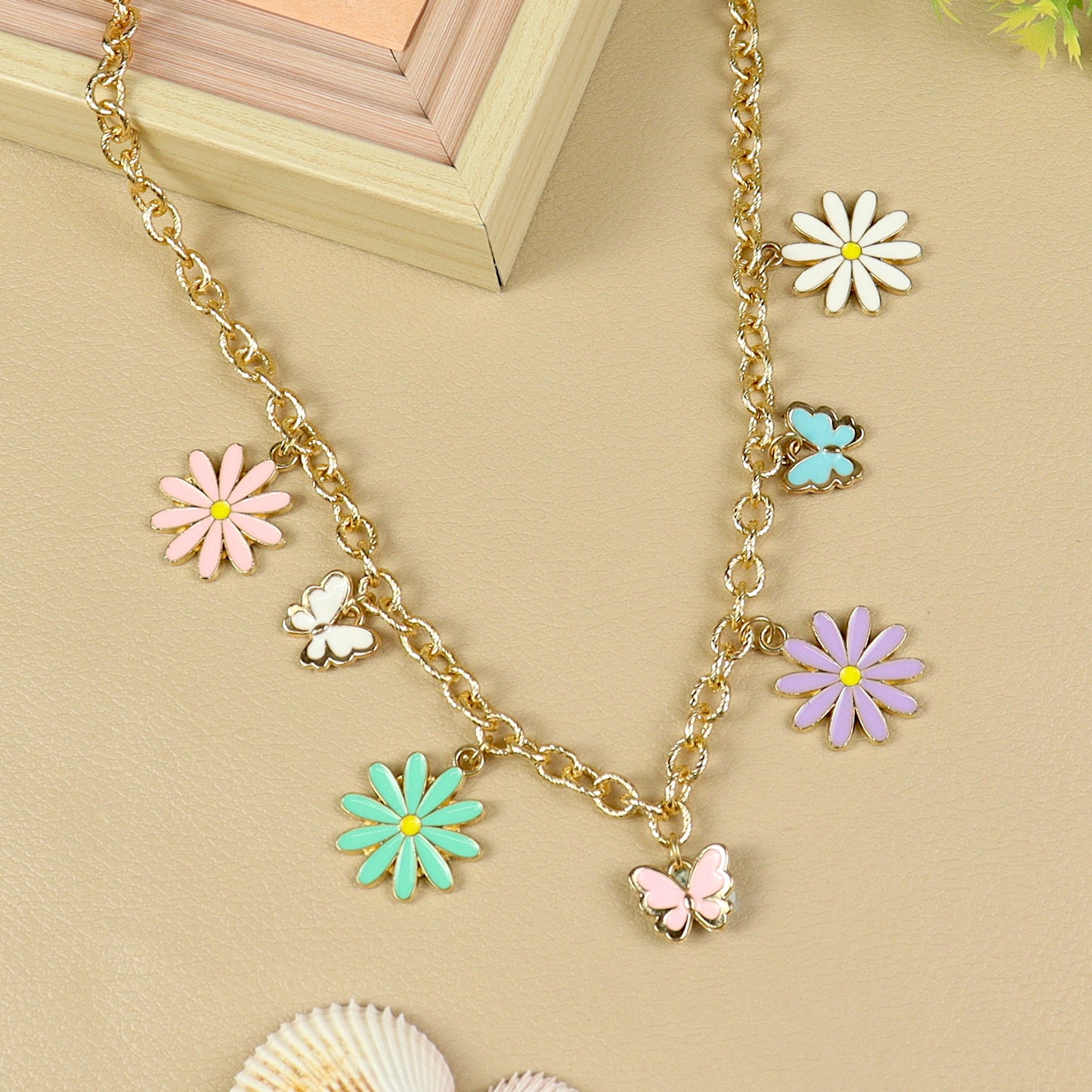 Floral Butterfly Charm necklace for girls in metal charms, laid flat