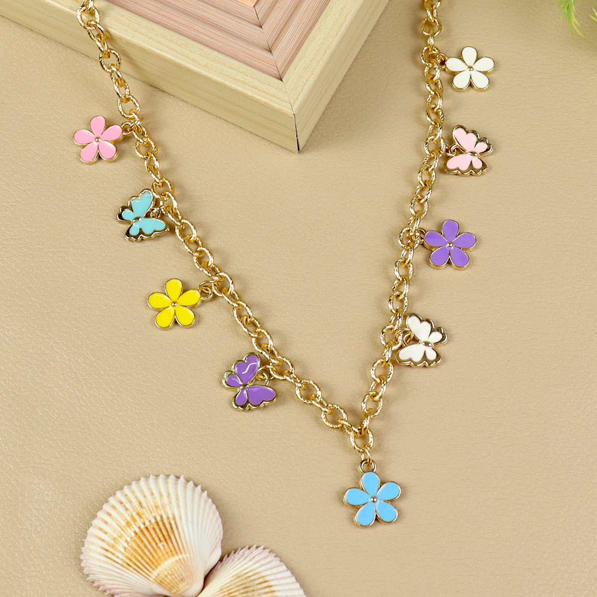 Floral Butterfly Charm necklace for girls in metal charms, laid flat