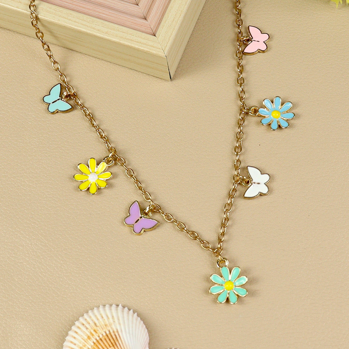 Floral Butterfly Charm necklace for girls in metal charms, laid flat