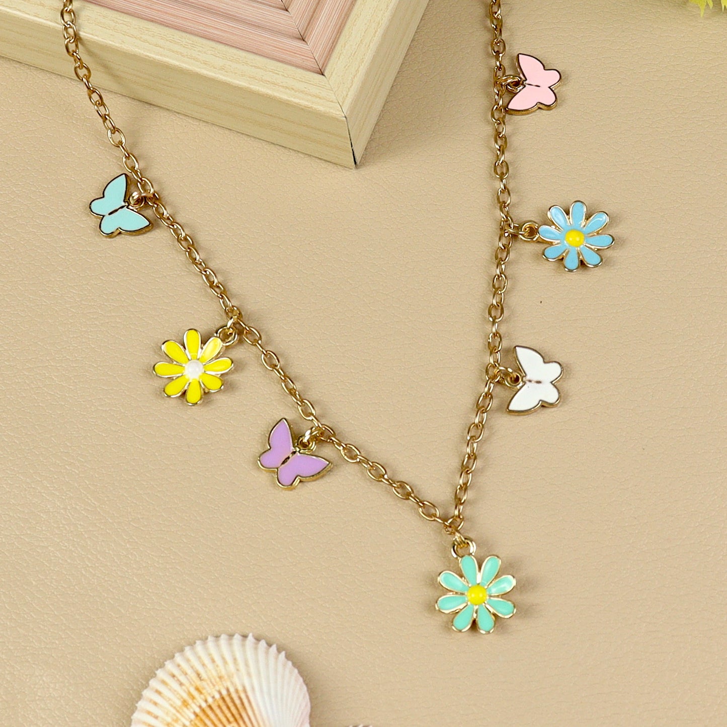 Floral Butterfly Charm necklace for girls in metal charms, laid flat