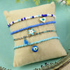 Set of 4 evil eye bracelets for girls, laid flat