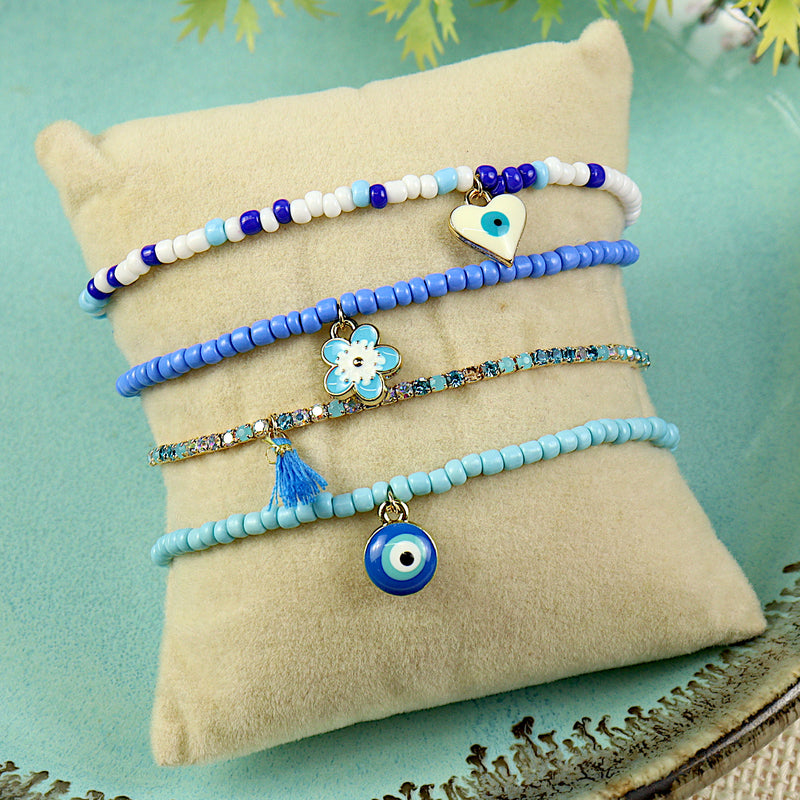 Set of 4 evil eye bracelets for girls, laid flat