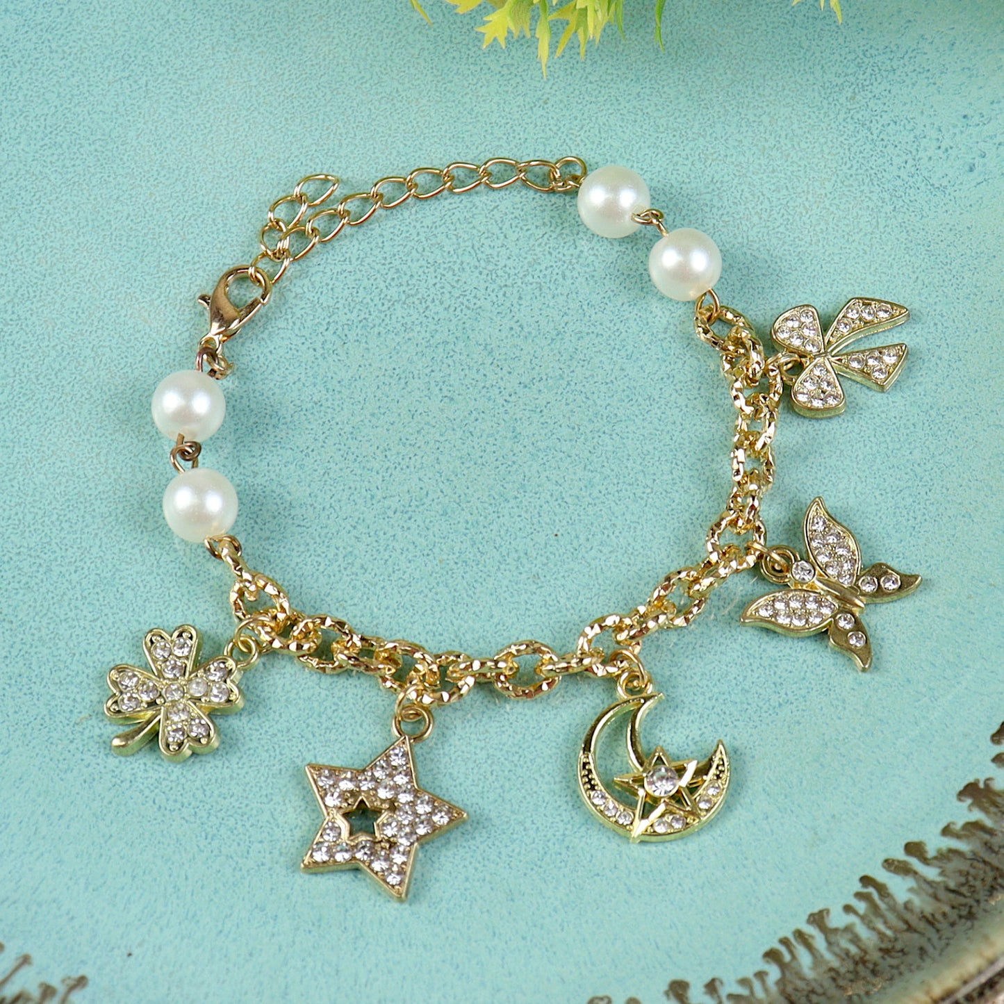 Multi Diamond Charms bracelet for girls in metal charms, laid flat