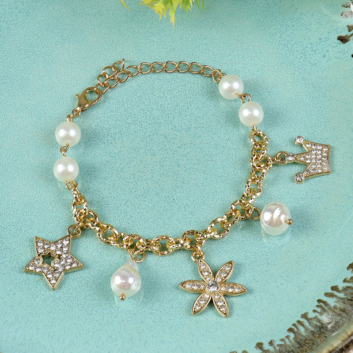 Multi Diamond Charms bracelet for girls in metal charms, laid flat