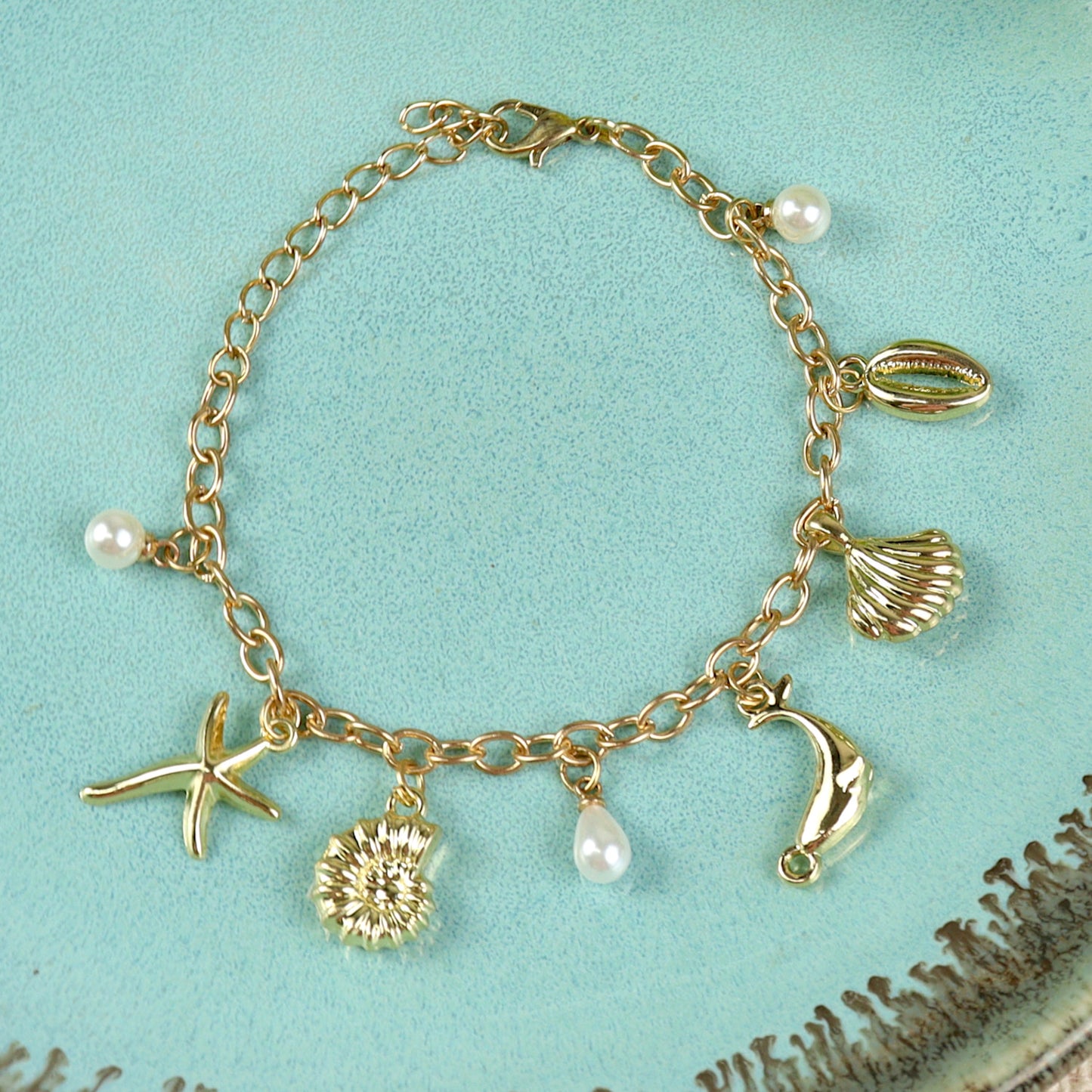 Multi Sea Charms bracelet for girls in metal charms, laid flat