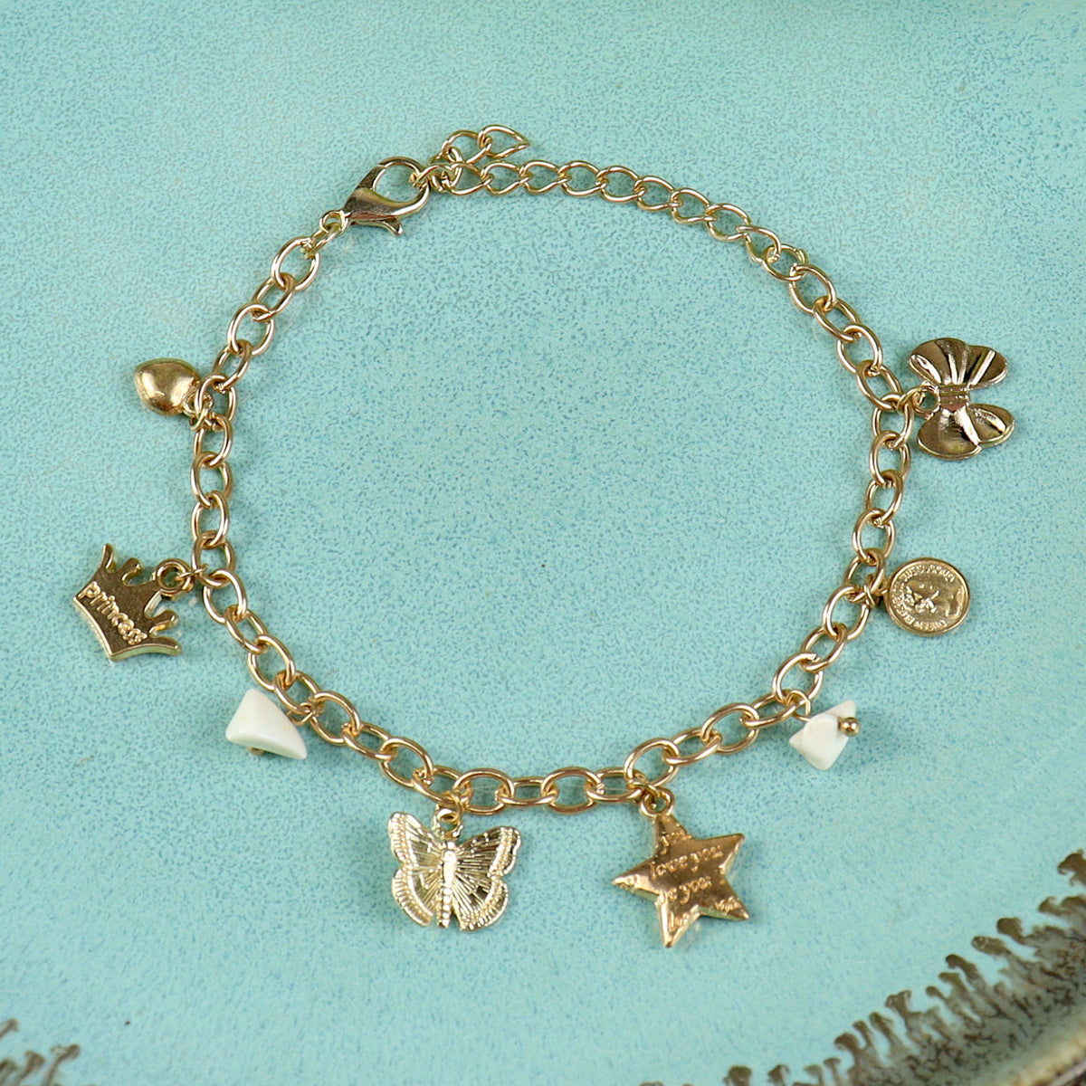 Multi Charms bracelet for girls in metal charms, laid flat