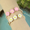 Set of 2 floral boho bracelets for girls in resin charms on woven thread, laid flat