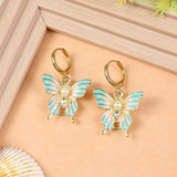 Butterfly Charm earrings for girls in metal charms, laid flat